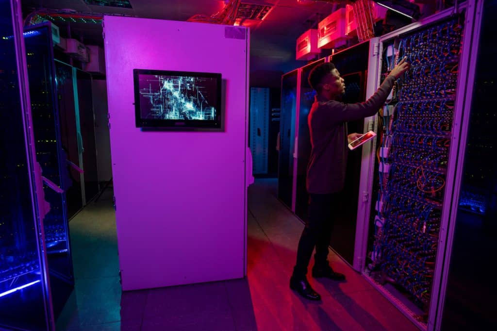 professional IT provider working on servers in server room