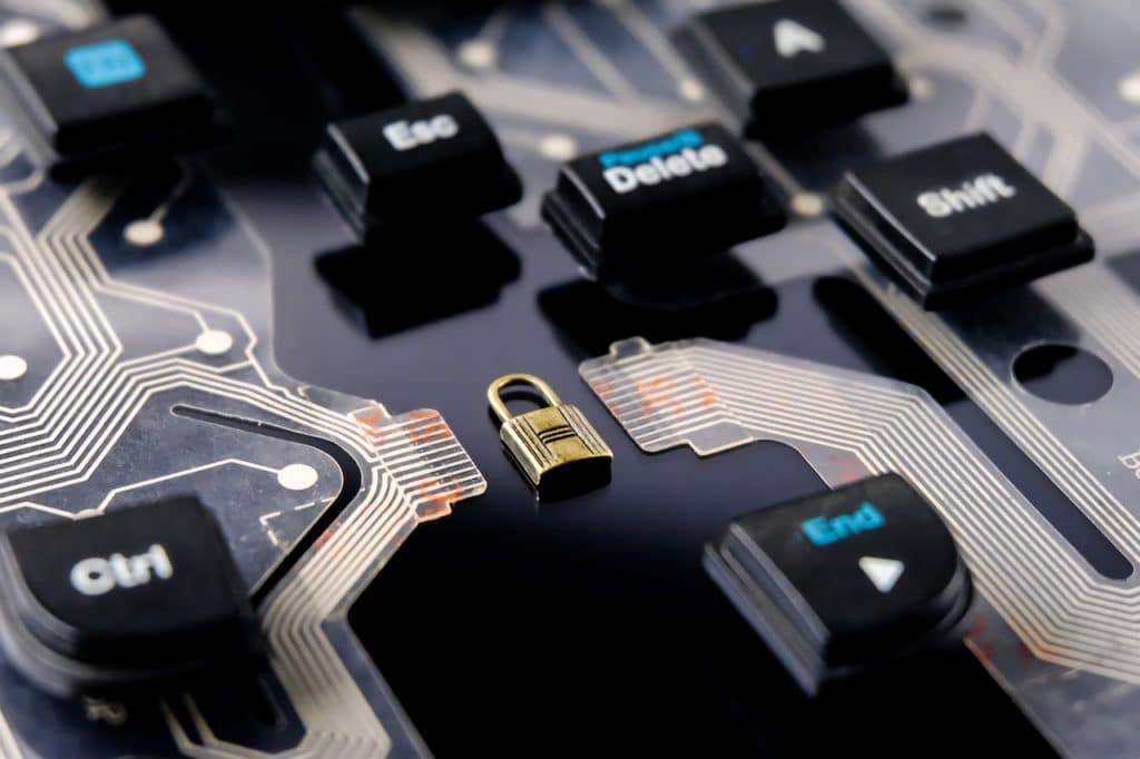 close up of motherboard with lock on it, symbolizing protection from cyber attacks