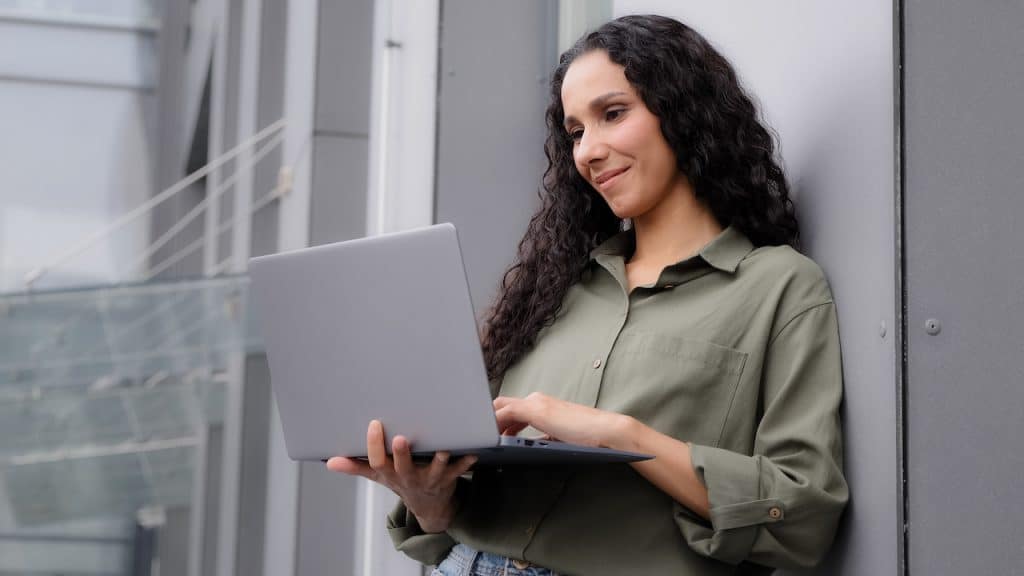 it provider standing in office, working on computer