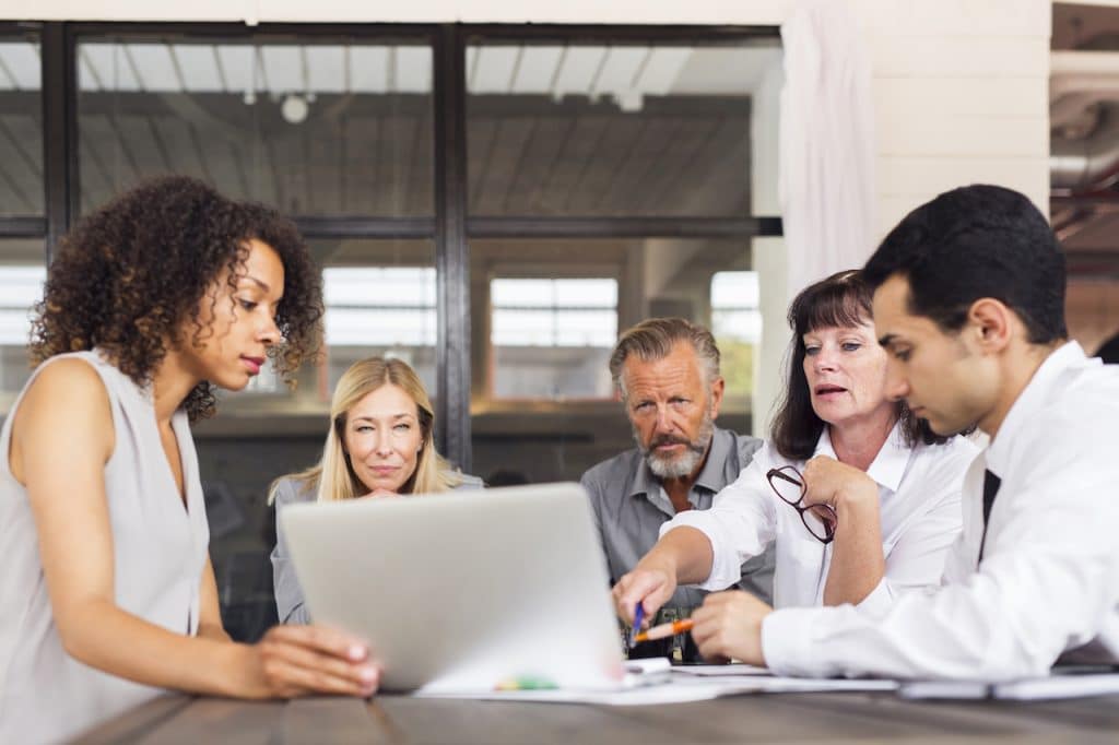 business colleagues reviewing data recovery plan for their company