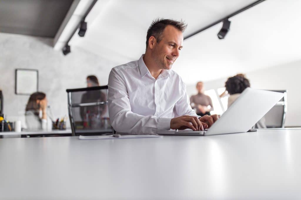 man at work online using remote computer support services