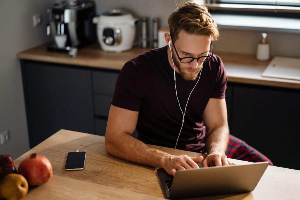 man working from home supported by managed IT company