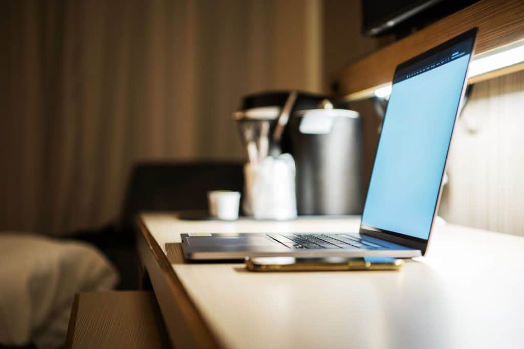laptop open on desk using cloud servers