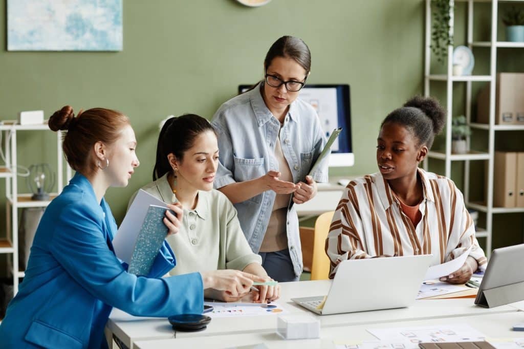 IT security providers using laptops at desk