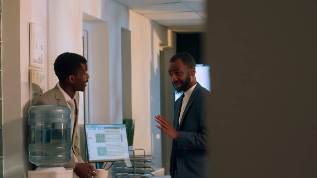Coworkers using downtime to talk at a company