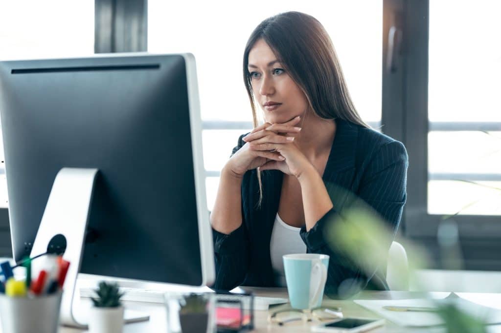 concentrated woman at work looking at computer