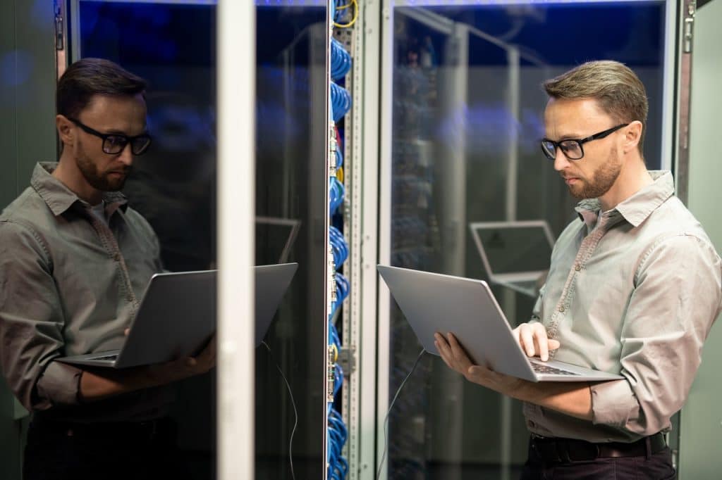 network support engineer working in server room