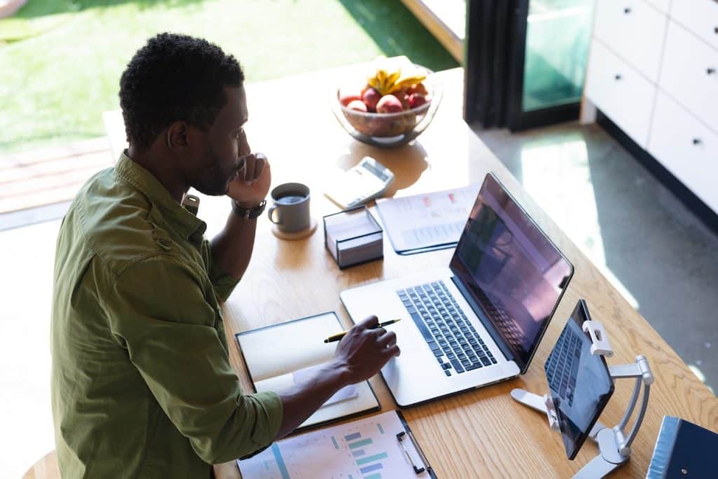 man working from home using remote tech support services
