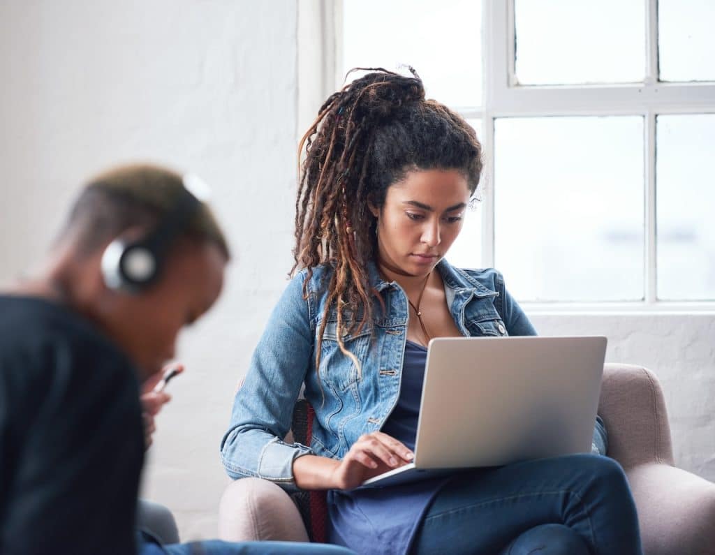 woman on laptop at work using cloud computing technology