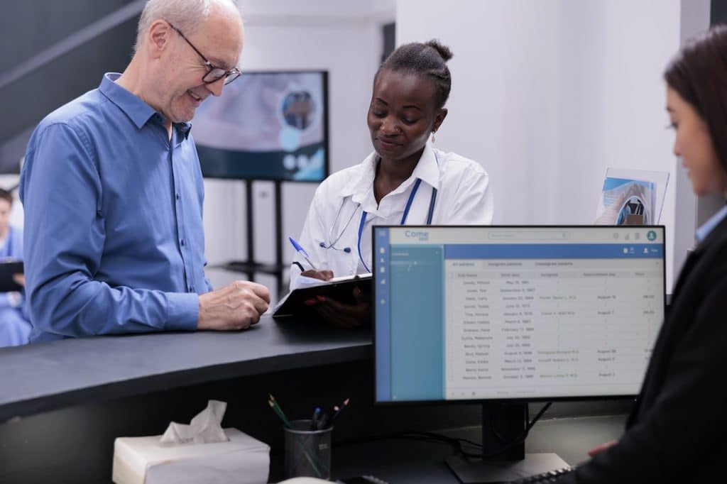 healthcare workers using business IT solutions at medical clinic